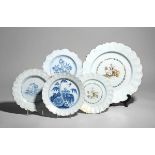 Four delftware plates and a charger c.1760, Bristol or Liverpool, two decorated in blue with