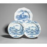 A pair of Bristol delftware plates mid 18th century, painted in blue with a figure in a boat