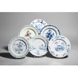 Six delftware plates mid 18th century, one painted in blue with peony beside an ornamental fence,