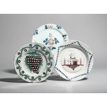 Three delftware plates c.1740-70, probably London, one painted in green and manganese with a large