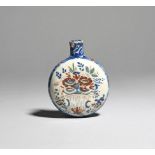 A small delftware spirit flask c.1730-50, probably English, the flattened circular form painted in