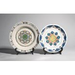 Two delftware chargers c.1700 and c.1740, one probably London and decorated in blue, yellow and