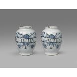 A pair of delftware drug jars mid 18th century, the ovoid bodies painted in blue with narrow