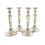 A set of four George III silver candlesticks, by John Roberts and Co., Sheffield 1808, tapering