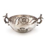 A South American silver wine taster, unmarked, possibly late 18th century, circular form, the centre