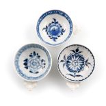 Three Derby blue and white wine tasters, c.1765-75, of shallow circular form, the exteriors with