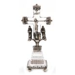 A silver mounted rock crystal crucifix, unmarked, probably late 19th century, the cross with foliate