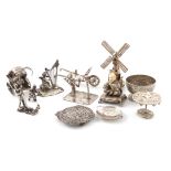 λ A collection of silver miniatures, comprising: a German figure, modelled as an oriental man seated