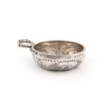 An early 19th century French provincial silver wine taster, makers mark of GB, 1819-1838, circular