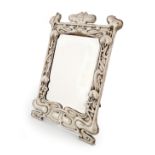 An Edwardian Art Nouveau silver mirror, by William Neale, Chester 1903, upright rectangular form,