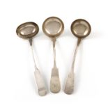 A small collection of three 19th century Scottish provincial silver Fiddle pattern toddy ladles,