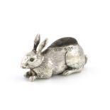 An Edwardian silver novelty rabbit pin cushion, by Adie and Lovekin, Birmingham 1908, modelled in