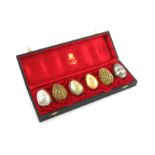 By Stuart Devlin, a set of six modern silver-gilt and parcel-gilt silver eggs, London 1983-85,