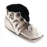 An Edwardian novelty silver boot pin cushion, by Levi and Salaman, Birmingham 1905, the boot with