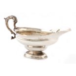 A George III Scottish silver sauce boat, by Adam Graham, Glasgow circa 1770, oval form, leaf