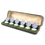 A set of six silver and enamel menu card holders, by Stuart Clifford & Co, London 1910, circular