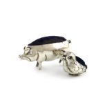 An Edwardian novelty silver pig pin cushion, probably by Sydney and Co, Birmingham 1907, modelled in