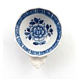 An English porcelain wine tasters, c.1760, possibly Vauxhall, of ogee form, painted with a central