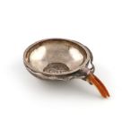 A metalware wine taster, unmarked, possibly Indian, circular form, the base set with an 8-Reales,