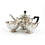 By George Hart for The Guild of Handicraft, a three-piece silver Arts and Crafts tea set, London