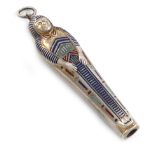 A novelty silver-gilt and enamel propelling pencil, unmarked, modelled as an Egyptian Mummy, with