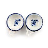 Two Derby blue and white wine tasters, c.1765, the circular forms moulded with gadroon flutes to the