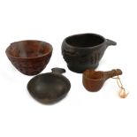 A small collection of three treen and one horn wine tasters, comprising: one of oval form, carved