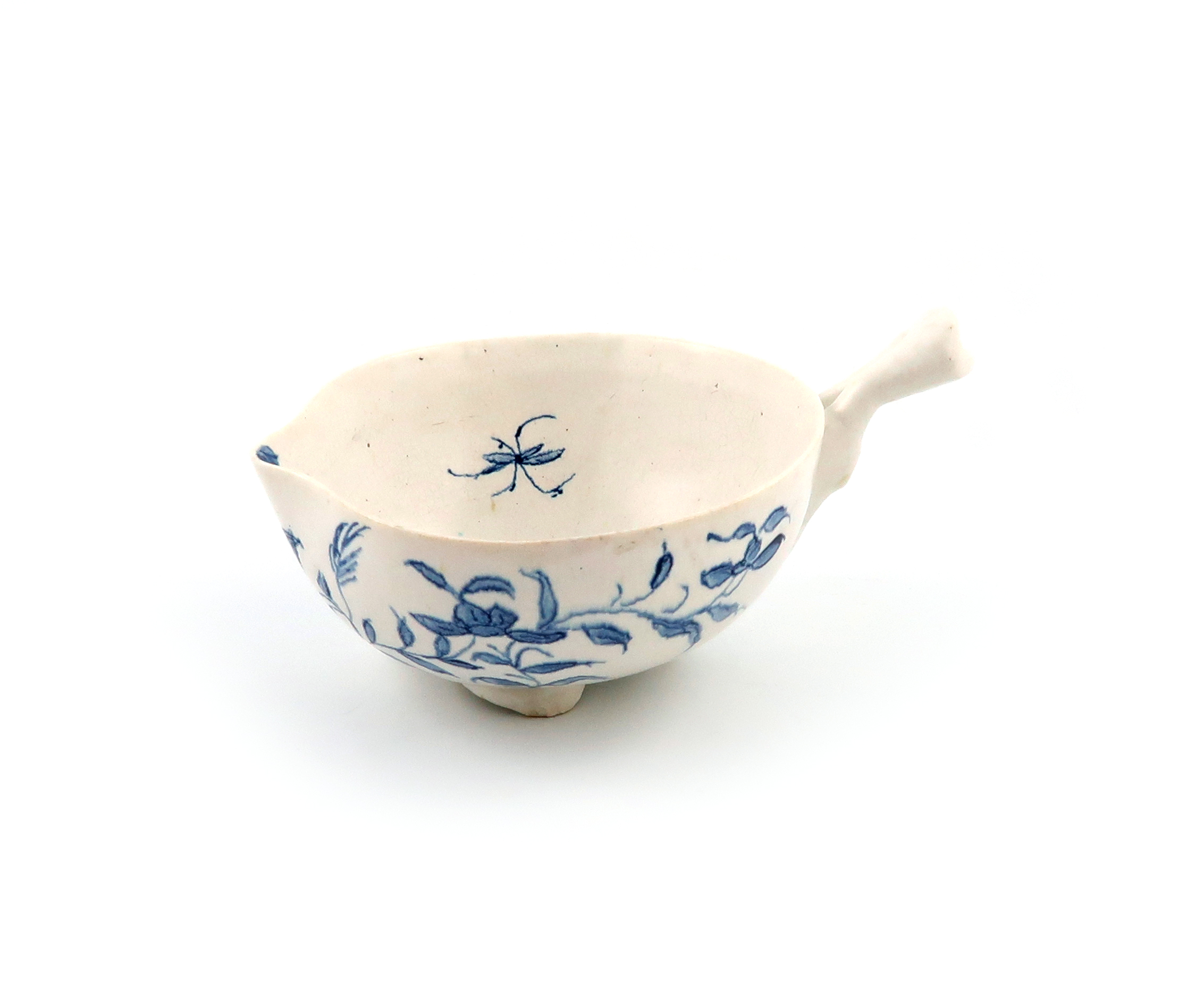 An English porcelain blue and white cup or wine taster, c.1755 or later, of peach shape, painted