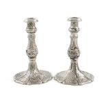 A matched pair of Victorian silver taper sticks, by Henry Hyde Aston, Birmingham 1863,