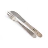 By Gerald Benney, a modern silver knife and fork, London 1969, the handles with textured decoration,