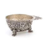 An American silver wine taster / dish, by Tiffany, circular form, chased foliate scroll decoration