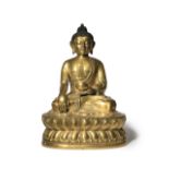 A CHINESE GILT-BRONZE FIGURE OF BUDDHA SHAKYAMUNI 18TH CENTURY Seated in dhyanasana wearing