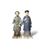 A PAIR OF CHINESE COLD PAINTED POTTERY NODDING HEAD FIGURES 19TH CENTURY Modelled as a Mandarin