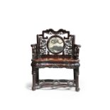 A LARGE CHINESE DREAMSTONE INSET HARDWOOD ARMCHAIR C.1900 The seat of ruyi outline, the backrest