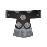 A CHINESE DARK BLUE-GROUND EMBROIDERED SILK SURCOAT LATE QING DYNASTY Decorated with eight large and