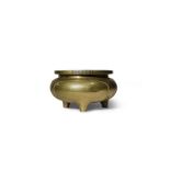 A CHINESE BRONZE TRIPOD INCENSE BURNER PROBABLY 19TH CENTURY The compressed circular body