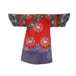 A CHINESE RED-GROUND EMBROIDERED SILK WOMAN'S INFORMAL ROBE LATE QING DYNASTY Finely embroidered