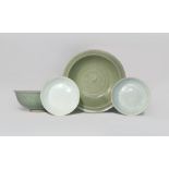 TWO CHINESE CELADON BOWLS AND A PAIR OF QINGBAI DISHES SONG DYNASTY OR LATER One celadon bowl