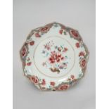 A LARGE CHINESE FAMILLE ROSE LOTUS-SHAPED DISH QIANLONG 1736-95 Painted to the centre with a large