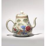 A LARGE CHINESE FAMILLE ROSE TEAPOT AND COVER QIANLONG 1736-95 The pear-shaped body painted in