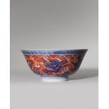 A CHINESE UNDERGLAZE BLUE AND IRON-RED ENAMELLED 'MYTHICAL BEASTS' BOWL PROBABLY LATE QING DYNASTY