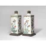 A PAIR OF CHINESE FAMILLE VERTE SQUARE-SECTION FLASKS KANGXI 1662-1722 Each painted with panels of