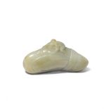 A CHINESE CELADON JADE CARVING OF A MONKEY ON A BOULDER QING DYNASTY Formed as the primate