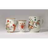 THREE CHINESE FAMILLE ROSE MUGS QIANLONG 1736-95 The largest painted with peony and fruiting lychee,