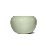 A CHINESE CELADON GLAZED JARDINIERE QING DYNASTY The ovoid body rising from a tapering foot to a