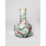 A CHINESE FAMILLE ROSE 'BATS AND PEACHES' BOTTLE VASE LATE QING DYNASTY Painted with five bats in