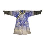 A CHINESE BLUE-GROUND EMBROIDERED SILK 'DRAGON' ROBE LATE QING DYNASTY Decorated in gold with