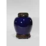 A CHINESE BLUE GLAZED OVOID VASE 1ST HALF 19TH CENTURY The vase gently tapering towards the foot and