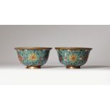A PAIR OF CHINESE CLOISONNE 'LOTUS' BOWLS MING DYNASTY The exteriors decorated with six large