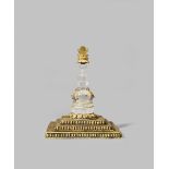 A NEPALESE ROCK CRYSTAL AND GILT-COPPER MODEL OF A STUPA 19TH/20TH CENTURY The crystal pillar